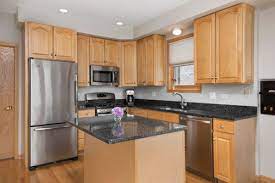 Oak cabinetry often features an orange finish that can make your kitchen appear outdated. Backsplash Rec Oak Cabinets With Dark Granite Counters Pls Help