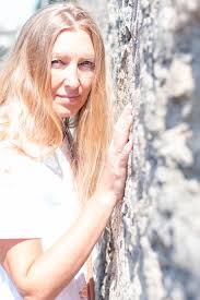 Ask your stylist about adding a bit of a shadow at your roots to. Blonde Girl With Long Hair Stands Against A Stone Wall Stock Photo Image Of Lean Blurred 166204698