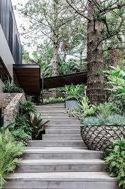 Contemporary Beachside Home Designed By Cadence Co Sloped Garden Outdoor Stairs Garden Stairs