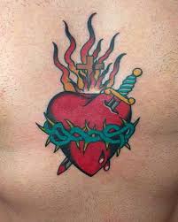 Wonderful kellie banner tattoo wirh lovely red heart. Updated 44 Sacred Heart Tattoo Designs August 2020