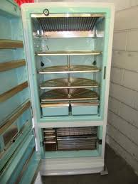 Refrigerator with a lazy susan built in. Sold Antique Appliances