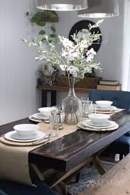 Artificial rose bouquets with ceramics vase fake silk rose flowers. A Tall Centerpiece On A Tan Or Natural Burlap Table Runner Is A Gorgeous Idea Dining Table Centerpiece Farmhouse Table Centerpieces Table Centerpieces For Home