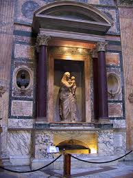 Rapahael's tomb in the Pantheon. Inscription reads "Here lies Raphael, by  whom Nature feared to be outdone while he lived, and when he died, feared  that she would die with him" :