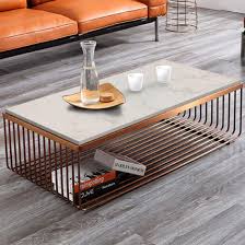 Whether you're hovering over your morning latte or kicking back for a glass of red with an old friend, the right piece can take you effortlessly from day to night, adapting to the surroundings to best serve the moment. China 2019 New Design Living Room Furniture Modern Simple Creative Iron Metal Marble Top Golden Coffee Table China Marble Top Coffee Table Iron Metal Coffee Table