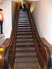 The steps run on tracks. Escalator Wikipedia