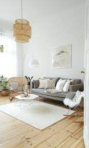 To balance the sweetness of bright pink, it's a good idea to add some black elements too. Bright And Modern Living Room With A Grey Couch A White Rug And A Light Wooden Floor We Love Th Wooden Floors Living Room Living Room Grey Living Room Modern