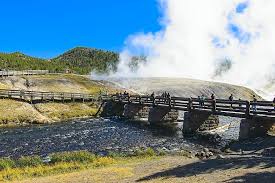 If you subscribe to the mantra go big or go home, do not leave yellowstone without visiting midway geyser basin. Bridge Over Firehole Thermal Vapor Sky Firehole River Midway Geyser Basin Yellowstone National Pikist
