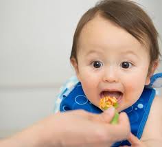 Navy wife surprises husband with 8-month-baby bump