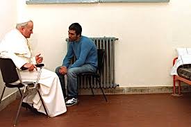 Pope John Paul II forgives his would-be assassin in 1983