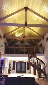 Vaulted ceiling with beams lighting. Ultra Warm White Led Strips Light Up The Vaulted Ceilings Of This Custom Home Vaulted Ceiling Lighting High Ceiling Lighting Vaulted Ceiling Kitchen