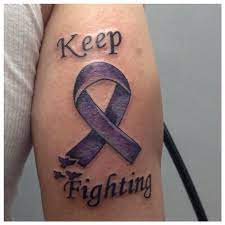 Women goes for cancer ribbon tattoo on their shoulder to show their disputed mood and to create awareness of the image credit goes to : Pancreatic Cancer Ribbon Tattoo