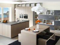 A Kitchen With A Cosy Feel To Contrast With The Sober Appearance Of The Matt Black Opted For Warm Contemporary Kitchen Remodel Kitchen Remodel Home Remodeling