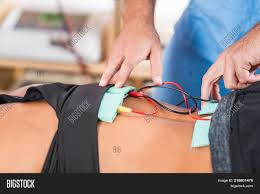Lie back on the floor with knees bent and feet flat, keeping the. Electrical Stimulation Image Photo Free Trial Bigstock