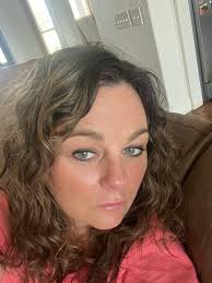 What hair color and style would complement my skin tone and face as I grow  out my gray hair?