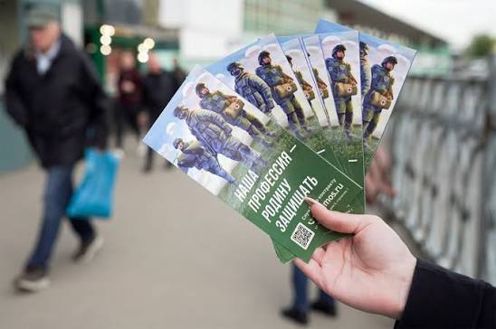 Russian military recruitment posters and enlistment center signage in Moscow.