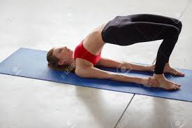 Many variations of this exercise are employed throughout the world, most commonly the balancing of the body on the hands and the feet. Side View Of Young Woman Doing Gymnastics The Half Bridge Pose In Fitness Studio Or Yoga Warming Up Exercises For Spine Backbend Strengthening Back And Shoulders Muscles Stock Photo Picture And Royalty