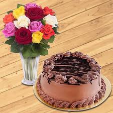 Order a freshly baked cake for delivery across mumbai. Assorted Roses Arranged In A Glass Vase N Chocolate Cake To Mumbai Free Shipping
