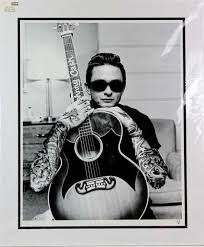 A pensive cash poses for a dark, moody, portrait in 1957 in memphis. J J Adams Johnny Cash Mutualart