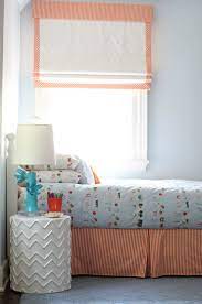 A bedroom surrounded with windows makes finding practical and stylish window treatments a challenge. J Wants Orange Roman Shades Boy Room Outside Mount Roman Shades