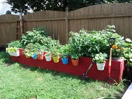 The raised garden bed is a boxy unit that allows you to plant flowers, herbs, and vegetables just about anywhere outdoors. Pin By Barbara Samson On Gardening Ideas Raised Beds Raised Garden Beds Edible Garden