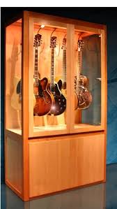 Purchase an ikea havsta glass door cabinet, 31 7/8 x 13 3/4 x 48 3/8″ (item # 104.151.98), which is tall enough to contain a standard guitar and has glass doors for admiring your investment. Pin By Carisa Mahnken Design Guild On Rooms Guitar Practice Guitar Display Guitar Cabinet Guitar Display Case