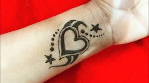 To give it a better and interesting look, the artist have painted around the heart with roses and leaves. How To Make Temporary Heart Shape Tattoo With Mehndi Diy Heart Shape Henna Tattoo Mehndi Design Youtube
