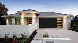 White stucco house with black windows. Traditional Garage Doors Heritage Garage Door