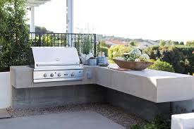gray wood and concrete outdoor kitchen