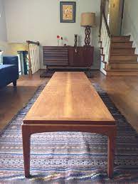 This small coffee table converts into a extra long/wide dinner table by doubling in length and raising in height. Extra Long Coffee Table