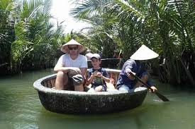 Steer your boat to avoid boats and islands or you'll be bailing water. My Son Holyland Basket Boat Ride Lantern Making Private Full Day Tour Marriott