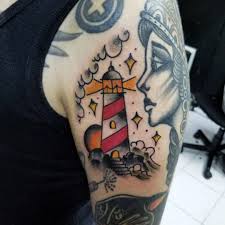 Black tattoo of a ship in a bottle dotwork sailing ship and lighthouse tattoo on the right arm ship tattoo meaning. Updated 40 Enduring Lighthouse Tattoo Design August 2020