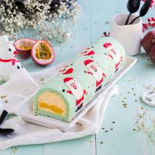 La Buche Du Pere Noel Mangue Et Fruits De La Passion Feerie Cake Recette Dessert Noel Dessert Noel Biscuit De Noel