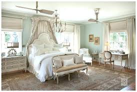 Dramatic drapes, plenty of gold, and ornate lighting make this master bedroom a french dream. French Country Bedroom Style Master Bedrooms Atmosphere Ideas Romantic Furniture Pink Curtains Rustic Decor Apppie Org