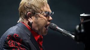 Elton John performs at American Bank Center