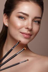 Beautiful Young Girl with Natural Nude Make-up with Cosmetic Tools in  Hands. Beauty Face Stock Photo - Image of gloss, master: 112046260