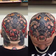 A million little dots in place of hair follicles give the look of a buzzcut on guys who have lost their hair, but don't want to be fully bald. Neotraditional Double Wolf Head Tattoo On The Head