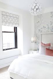Go big and go bold, even in a small space, with a wallpaper feature wall. Pink Blue Gray Chinoiserie Wallpaper On Accent Wall Transitional Bedroom