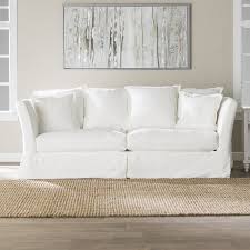 Rolled arms and skirted base are traditional aesthetics that will last a lifetime. 20 Best White Slipcovered Sofas In Every Style Candie Anderson