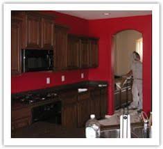 red accent wall in kitchen with brown