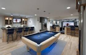 Basement Open Floorplan With Contemporary Furniture 600x387 Diy Caving Manning Up To Cave Your Basement Modern Basement Basement Design Home Bar Designs