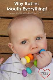 Why Do Babies Put Everything In Their Mouth Laughing Kids Learn Kids Learning Infant Activities Kids Blogger Network