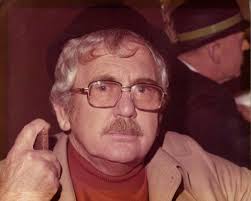 What is the story behind the framed picture hanging in the school's office?