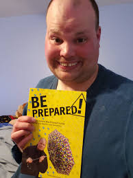 Here is me holding a copy of my book Be Prepared the Frankie MacDonald  guide to life weather and everything during the covid-19 outbreak