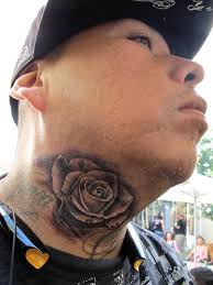 Butterfly with skull on chest with flower designs on the back. 51 Best Rose Neck Tattoos