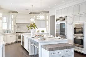 An overhead chandelier and decorative centerpiece will add to the feeling that the table is meant for entertainment rather than the overflow of work that can. Kitchen Island With Drop Down Table Design Ideas