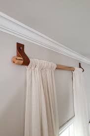 Lay the other panel on the floor. Diy Wood Curtain Rods With Leather Straps For Under 10 Dani Koch