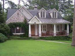 This tudor style home has wood beams, clipped gables, diamond pane windows & arched design. 11 Ranch Tudor Conversion Ideas House House Exterior Ranch House
