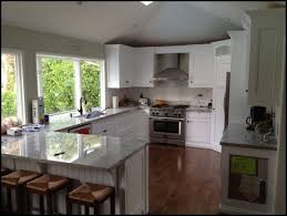 This idea for kitchen, same shape it is now but the counter could have a big opening window that goes onto deck but you can still sit on either side of it and eat. Kitchen L Shaped Kitchen Designs With Breakfast Bar Best L Shaped Kitchen Layout Kitchen Cabinets Wholesa Kitchen Layout L Shape Kitchen Layout Kitchen Design