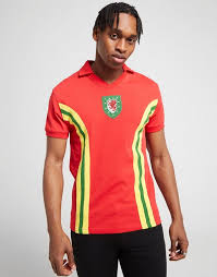 Wales play in a red and green home strip. Official Team Wales Home 1976 Shirt Men S
