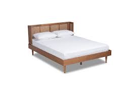 Leffler brookside upholstered bed with nail heads in lisburn rattan sophistication at its finest the brookside nailhead queen bed is an elegant piece for your bedroom. Rina Mid Century Rattan Queen Platform Bed Ashley Furniture Homestore